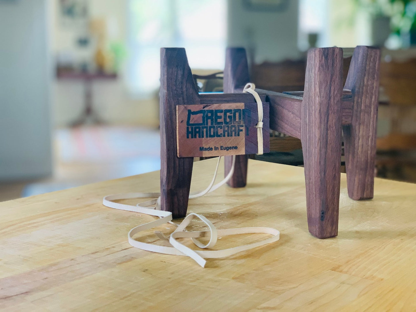 Little plant stand featured in walnut hardwood with oregon handcraft logo.