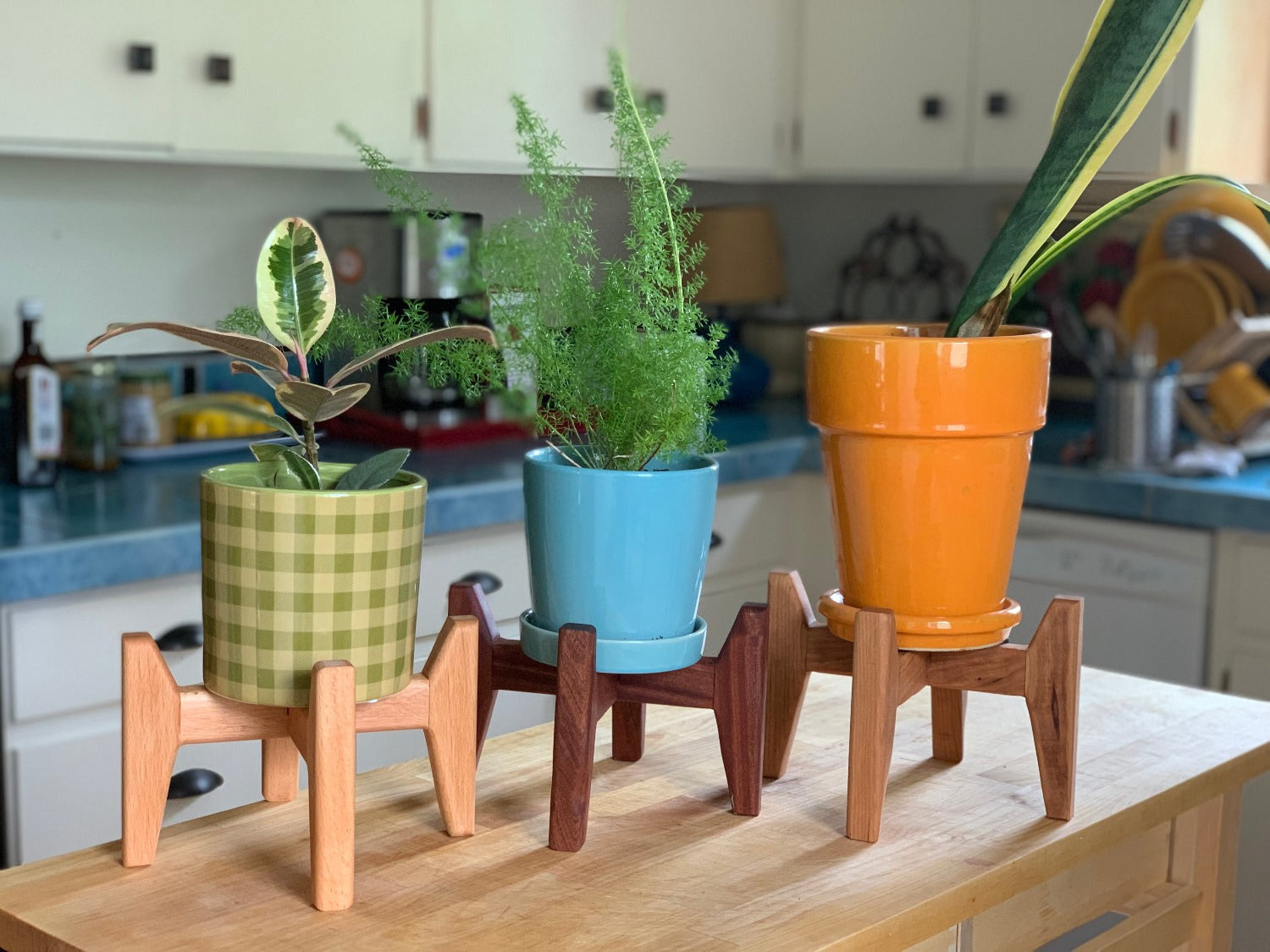a photo of three little plant stands made by oregon handcraft featured in Sapele, Beech and Cherry hardwoods.